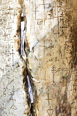 In the cracks of the pillars some believers insert prayer notes, Holy Sepulchre Church, Jerusalem, Israel, Middle East