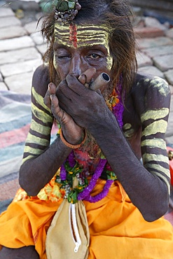 Indian sadhu smoking a chilum in Vrindavan, Uttar Pradesh, India, Asia