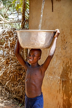 Collecting water in a Zou province village, Benin, West Africa, Africa