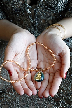 Buddhist woman with a Buddha pendant, Vung Tau, Vietnam, Indochina, Southeast Asia, Asia