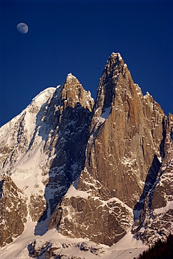 Jagged peak of Aiguille du Dru and the moon, Chamonix, Rhone Alpes, France, Europe