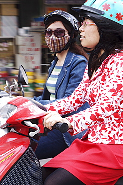 Girls on scooters, Hanoi, Vietnam, Indochina, Southeast Asia, Asia