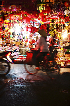 Cyclist in front of lantern stall, Hanoi, Vietnam, Indochina, Southeast Asia, Asia