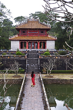 Vietnamese schoolgirl walking over bridge to Minh Lau Pavilion (Bright Pavilion), Hue, Vietnam, Indochina, Southeast Asia, Asia