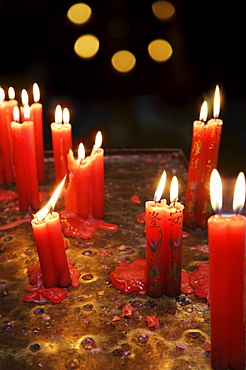 Candle offerings in Buddhist temple, Ho Chi Minh City, Vietnam, Indochina, Southeast Asia, Asia