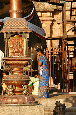 A woman prays at the temple of Tanjore, Tamil Nadu, India, Asia