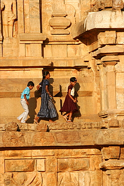 Children on the wall of the temple of Tanjore, Tamil Nadu, India, Asia