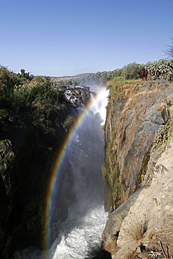 Rainbow at Epupa falls, on the Kunene River, in Himba country, on the border with Angola, Namibia, Africa