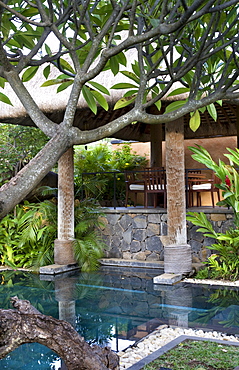 Outdoor pool and dining loggia with wood and rope columns, Baie aux Tortues, Pointe aux Pimentes, Mauritius, Africa