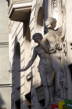 Female figure sculptures on building, Prague, Czech Republic, Europe