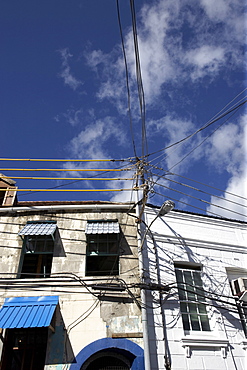 Wormeye view of upper stories of traditional housing and sky, Grenada, Windward Islands, West Indies, Caribbean, Central America