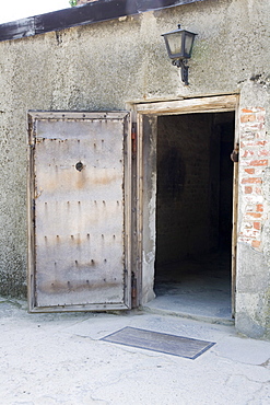 The wooden entrance door into the Gas Chambers at Auschwitz Concentration Camp, Poland, Europe