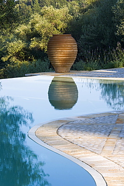 Infinity pool and terracotta urn, Kerkyra, Corfu, Ionian Islands, Greek Islands, Greece, Europe