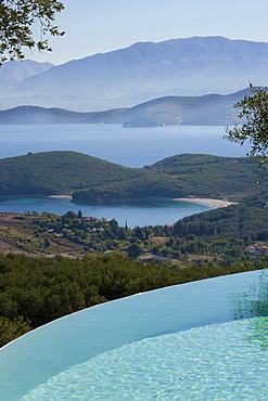 Vew across infinity pool to the Ionian Sea and Albanian Mountains, Kerkyra, Corfu, Ionian Islands, Greek Islands, Greece, Europe