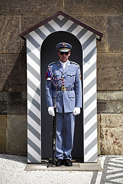 A guard stands in a sentry box at Prague Castle, Prague, Czech Republic, Europe