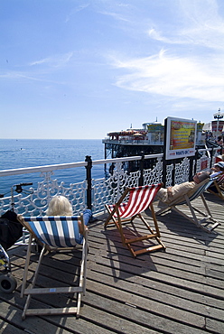 Deckchairs on Brighton Pier, Brighton, Sussex, England, United Kingdom, Europe