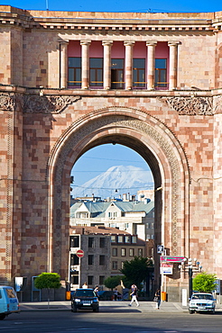 Armenian architecture with view through arch of Mount Ararat in the distance, at the Hanrapetutyan Hraparak (Republic Square), Yerevan, Armenia, Caucasus, Central Asia, Asia