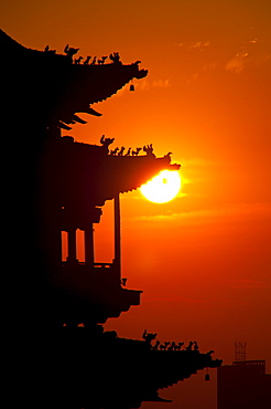 Sunset at the entrance gate of Pingyao, renowned for its well-preserved ancient city wall, UNESCO World Heritage Site, Shanxi, China, Asia