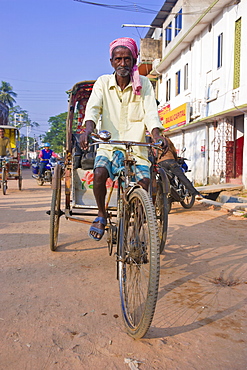 Rickshaw driver on his bicycle, Agartala, Tripura, Northeast India, Asia