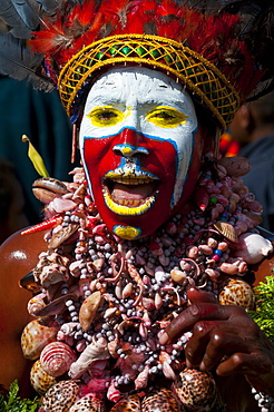 Colourfully dressed and face painted local tribes celebrating the traditional Sing Sing, Mount Hagen, Highlands of Papua New Guinea