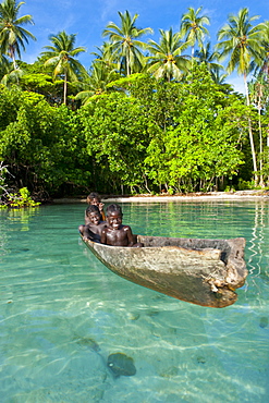 Young boys fishing in the Marovo Lagoon, Solomon Islands, Pacific