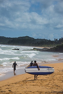 Surfer on Luquillo Beach, Puerto Rico, West Indies, Caribbean, Central America