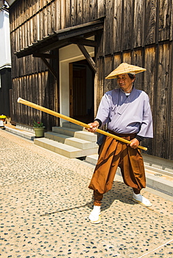 Traditionally dressed man in Dejima, man made island in the port of Nagasaki, Kyushu, Japan, Asia