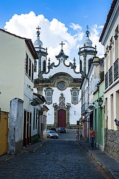 Road with colonial buildings leading to the Nossa Senhora do Carmo church in Sao Joao del Rei, Minas Gerais, Brazil, South America