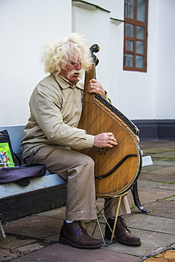 Man playing the traditional Bandura instrument, St. Sophia´s cathedral, Kiev, Ukraine, Europe