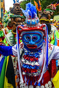 Colourful dressed masked man in the Carneval (Carnival) in Santo Domingo, Dominican Republic, West Indies, Caribbean, Central America