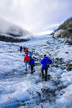 Tourist hiking on Fox Glacier, Westland Tai Poutini National Park, South Island, New Zealand, Pacific