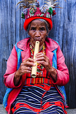 Traditional dressed Ifugao women playing the flute in Banaue, UNESCO World Heritage Site, Northern Luzon, Philippines, Southeast Asia, Asia