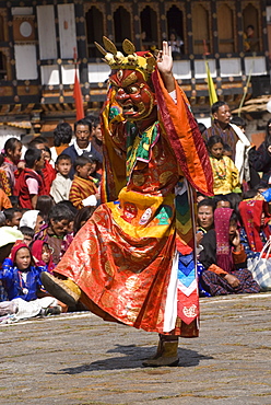 Masked dancer at religious festival with many visitors, Paro Tsechu, Paro, Bhutan, Asia