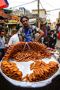 Man selling sweets in the Old Town, UNESCO World Heritage Site, Sanaa, Yemen, Middle East