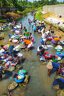 Women washing clothes in a river bed, City of Sao Tome, Sao Tome and Principe, Atlantic Ocean, Africa