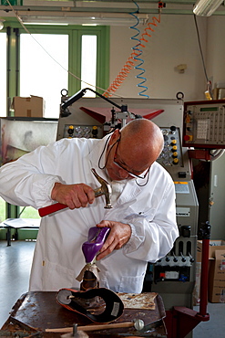 Teacher at work in the pattern making laboratory at Cercal footwear school and research center, San Mauro Pascoli, Emilia-Romagna, Italy, Europe