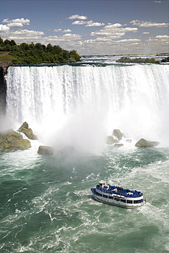 Maid of the Mist sails near the American Falls in Niagara Falls, New York State, United States of America, North America