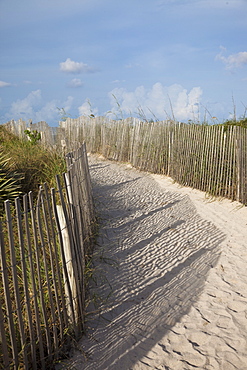 Sand held in place by fence on South Beach in Miami Beach, Florida, United States of America, North America