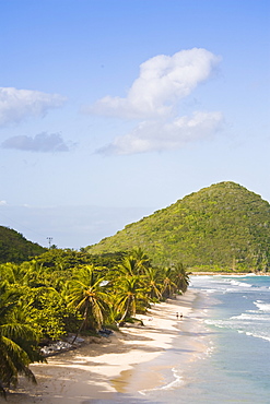 Two women walking on the sandy beach on Long Bay, Tortola, British Virgin Islands, West Indies, Central America