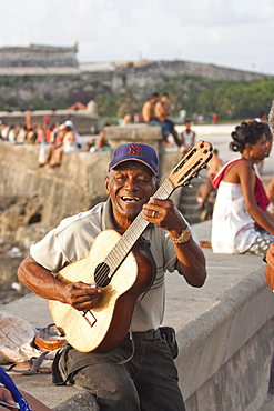 Guitar player on the Malecon in Havana, Cuba, West Indies, Central America