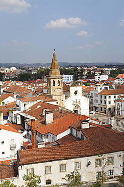 Roofs and the octagonal spire of the Church of St. John the Baptist (Sao Joao Baptista) in the city of Tomar, Ribatejo, Portugal, Europe