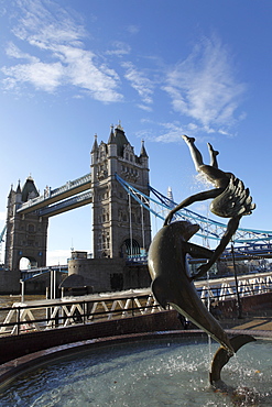 Tower Bridge and the Girl with Dolphin statue by David Wynne, by the River Thames, London, England, United Kingdom, Europe