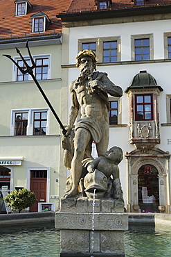 The Neptune Fountain on the cobbled Market Place (Marktplatz) in Weimar, Thuringia, Germany, Europe