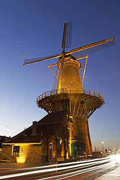 Light streaks by the Molen de Roos, a windmill in Delft, South Holland, The Netherlands, Europe