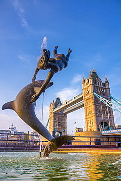 Tower Bridge over River Thames, Girl with a Dolphin fountain by David Wynne, London, England, United Kingdom, Europe