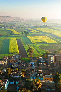 Ballooning over village near the Valley of the Kings, Thebes, Upper Egypt, Egypt, North Africa, Africa