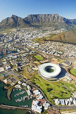 Aerial view of Cape Town showing Table Mountain, with Devil's Peak on the left, and the new Green Point stadium and Granger Bay marina in the foreround, Cape Town, South Africa, Africa