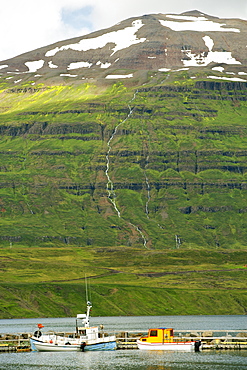 Fishing boats in the small port at Seydisfjordur, a fjord in the east, Iceland, Polar Regions