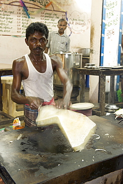 A dosa (South Indian pancake) being prepared at a roadside dhaba in Pondicherry India