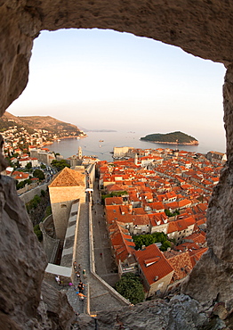 View from the Minceta Tower over the rooftops of the old town in the city of Dubrovnik, UNESCO World Heritage Site, with Lokrum Island beyond, Adriatic Coast, Croatia, Europe